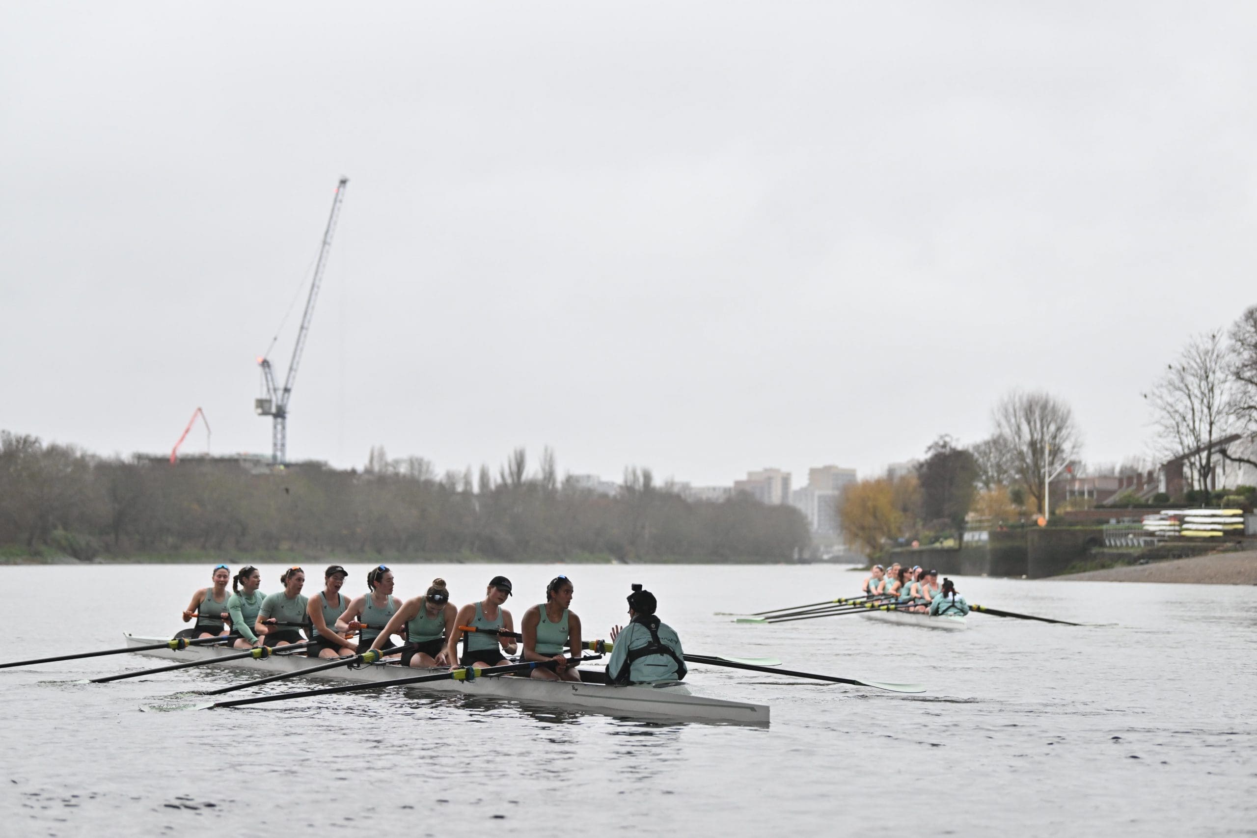 Cambridge women's crews approach the start for Trial Eights
